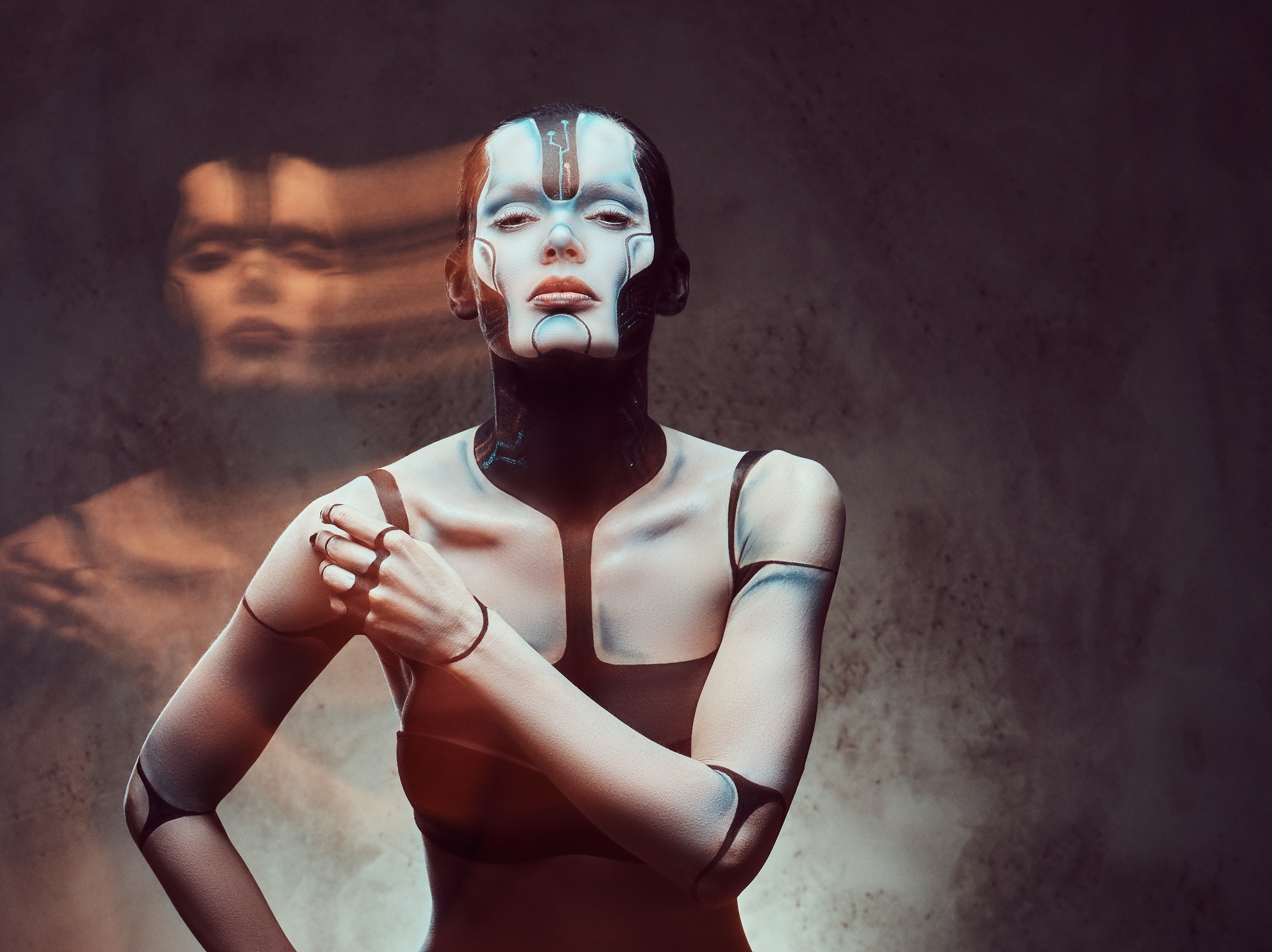 Sensual cyber woman. Technology and future concept. Isolated on a dark textured background.